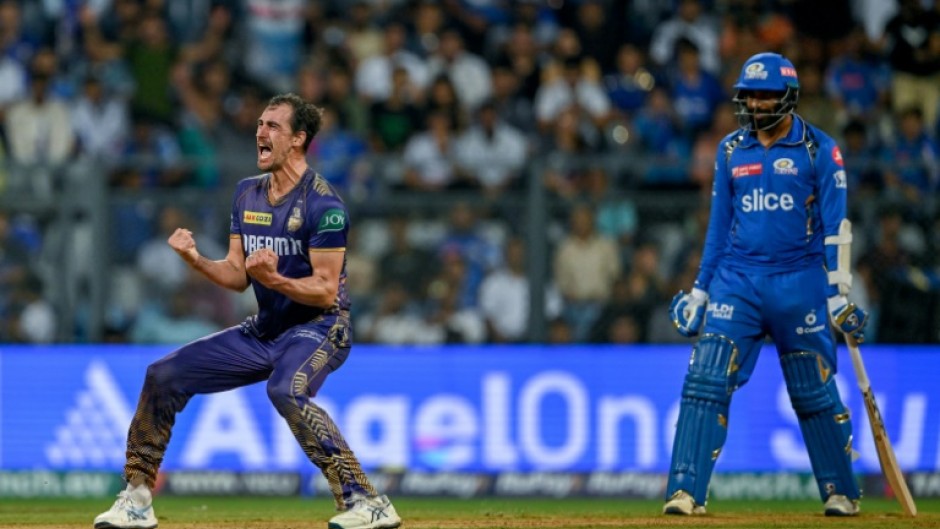 Kolkata Knight Riders' Mitchell Starc (L) celebrates after his team's win against Mumbai Indians in the IPL