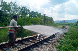Thai railway workers doused the melting tracks with water to try to bend them back into shape